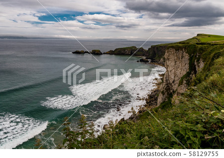 Ireland, the emerald island. Green landscapes, rough coastlines, high cliffs, ancient villages, cloisters and castles Ireland, the emerald island. Green landscapes, rough coastlines, high cliffs, ancient villages, cloisters and castles 58129755