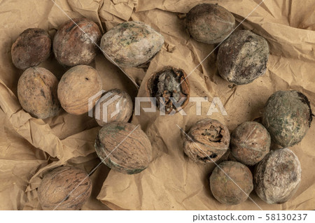 mouldy unpleasant walnuts as a background 58130237