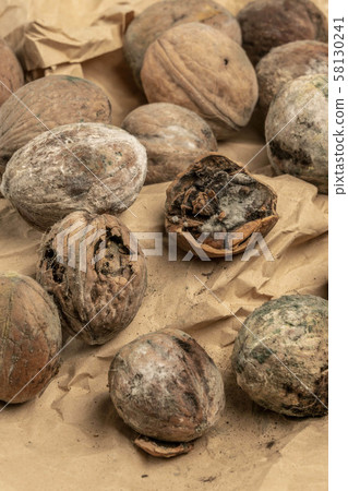mouldy unpleasant walnuts as a background 58130241