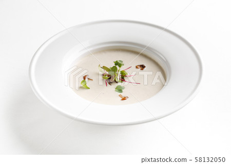 Mushroom cream soup in a white plate 58132050