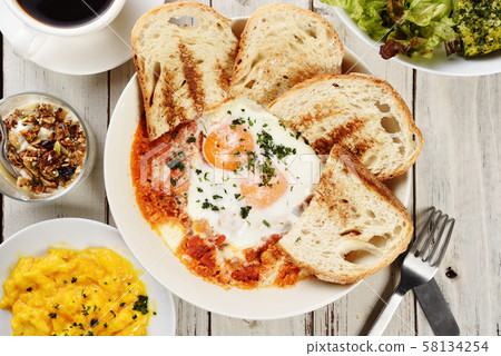 Sunny side up eggs with crsipy toasth Sunny side up eggs with crsipy toasth 58134254