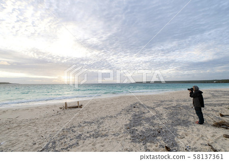 New Caledonia Loyalty Islands Lifou Island Female photographer on Champagne Beach New Caledonia Loyalty Islands Lifou Island Female photographer on Champagne Beach 58137361
