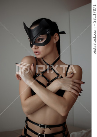 Brunette girl in a cat mask 58137871