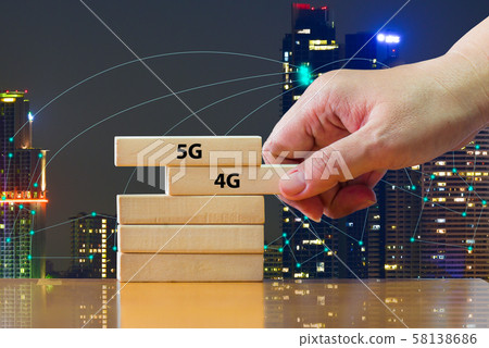 Close up hand picking domino 5G above 4G .That showing developed of best internet connection 5G is network connecting technology future global change from 4G to 5G system concept 58138686