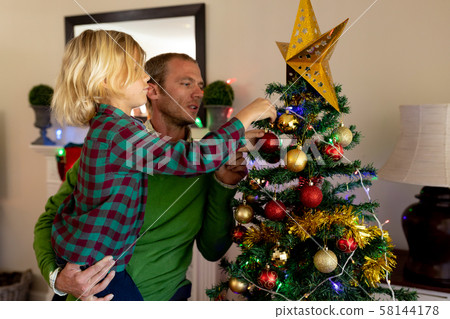 Family at home at Christmas time 58144178