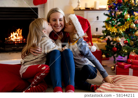 Family at home at Christmas time 58144211