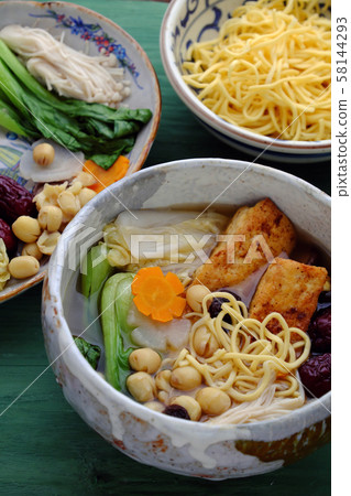 Vietnamese vegetarian homemade noodle soup, vegetables ingredient healthy dish Vietnamese vegetarian homemade noodle soup, vegetables ingredient healthy dish 58144293