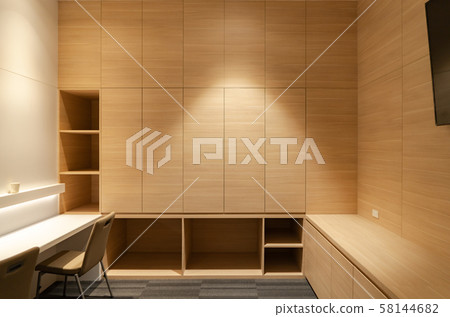 Empty wooden shelf and cabinet with lighting at 58144682