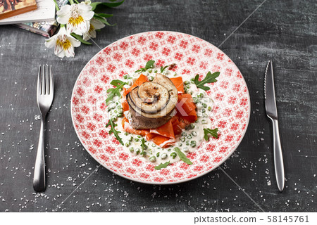 Tournedo from trout with carrot noodles with green peas 58145761