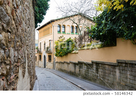 Narrow street in old town. Girona, Catalonia Narrow street in old town. Girona, Catalonia 58146342