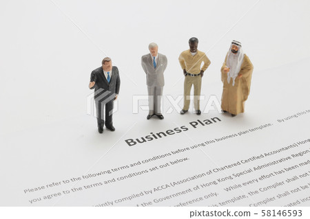 a figure of Business Team Discussing Over Market a figure of Business Team Discussing Over Market 58146593