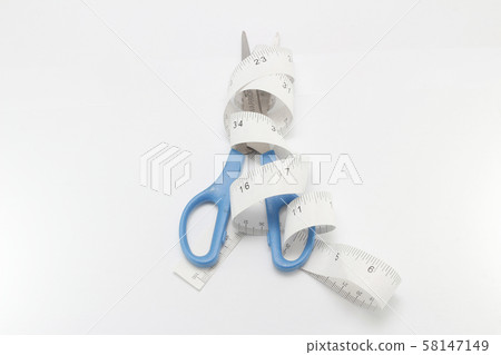 a tape of wrapped around a scissors 58147149