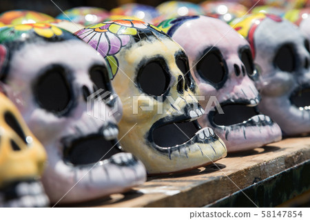 Mexican colorful skulls. Traditional Mexican souvenirs. The symbol of the holiday of the day of the Mexican colorful skulls. Traditional Mexican souvenirs. The symbol of the holiday of the day of the 58147854