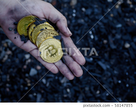 Hand holding a lot of cryptocurrency coins 58147855