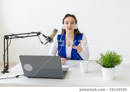 Radio, blogging, broadcast concept - woman dj is working on the radio 58148584