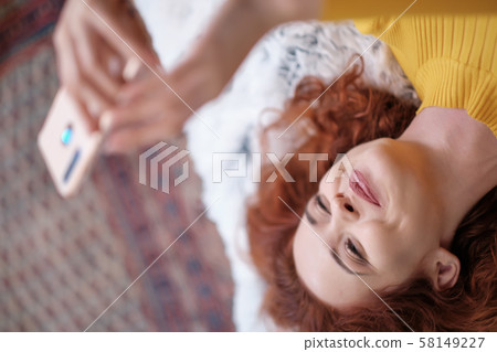 Smiling attractive young woman with beautiful long Smiling attractive young woman with beautiful long 58149227