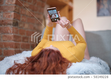 Smiling attractive young woman with beautiful long Smiling attractive young woman with beautiful long 58149228