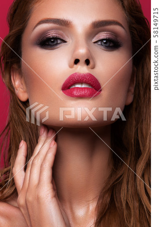 Portrait of beautiful girl with pink lips Portrait of beautiful girl with pink lips 58149715