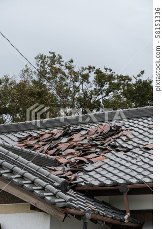 Tile roof damaged by strong wind Tile roof damaged by strong wind 58151336