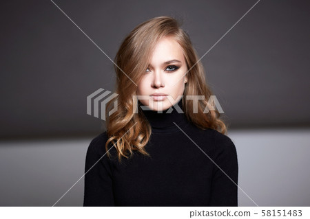 Beautiful girl with make-up and curly blond Hair 58151483