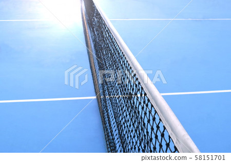 net of tennis court with white border line on blue floor net of tennis court with white border line on blue floor 58151701