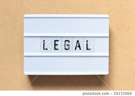 White lightbox with word legal on wood background White lightbox with word legal on wood background 58152069