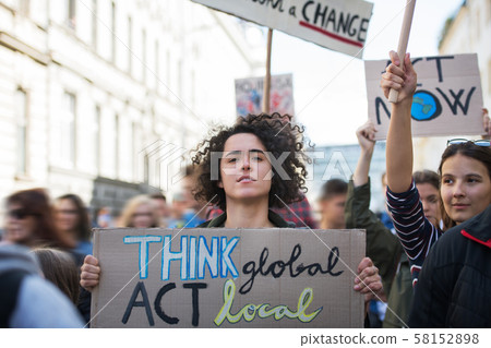 People with placards and posters on global strike for climate change. People with placards and posters on global strike for climate change. 58152898