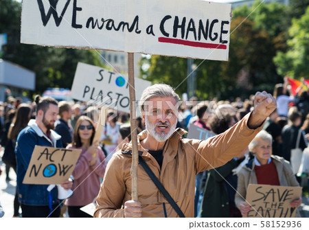 People with placards and posters on global strike for climate change. People with placards and posters on global strike for climate change. 58152936