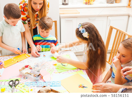 Children make greeting cards with their mothers in a masterclass 58156151