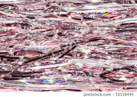 Pink shiny holographic tinsel background. Festive or party wallpaper. 58156495