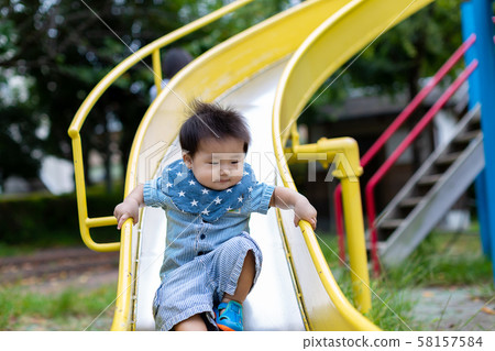 Infants playing in the park 58157584