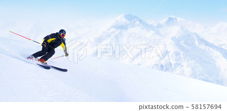 Skier in high mountains Skier in high mountains 58157694