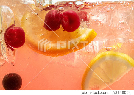 Close up view of the lemon slices in lemonade on background 58158004