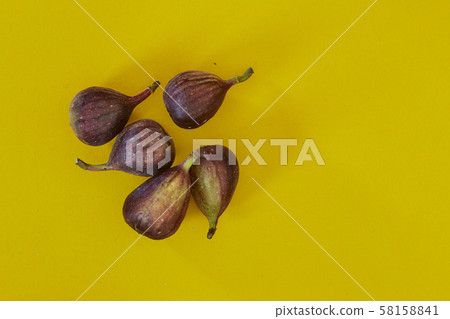 Fresh figs isolated on yellow background 58158841