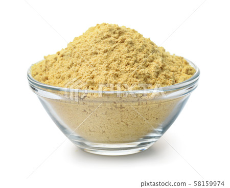 Glass bowl of mustard powder 58159974