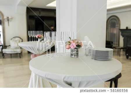A small auxiliary table in the restaurant, on 58160356