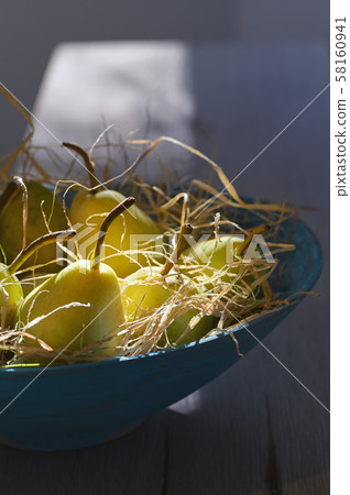 Pears in blue basket 58160941