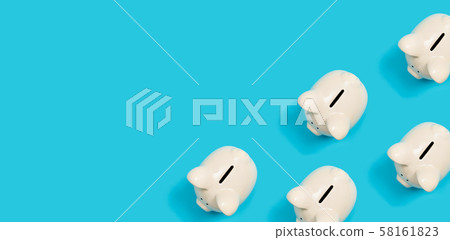 Many white piggy banks Many white piggy banks 58161823