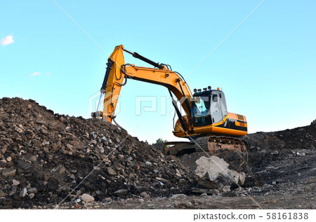 Excavator with crusher bucket for crushing concrete.  58161838