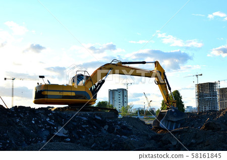 Excavator with crusher bucket for crushing concrete.  58161845
