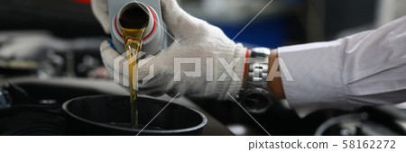 Male hand in white protective gloves with funnel Male hand in white protective gloves with funnel 58162272