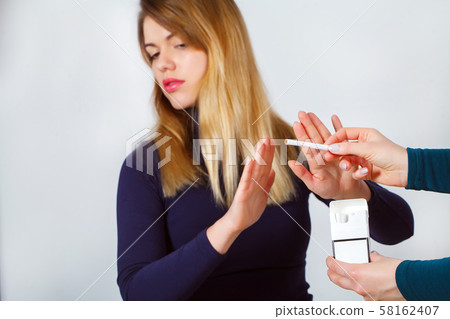 Closeup Of Woman Giving Up Smoking Cigarettes. Health Concept Closeup Of Woman Giving Up Smoking Cigarettes. Health Concept 58162407