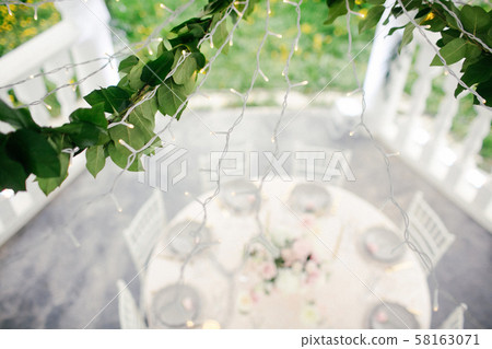 Amazing wedding table decoration with flowers on wooden tables for wedding dinner 58163071
