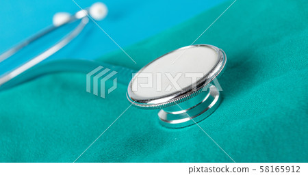 Stethoscope on green cloth in operating room , 58165912