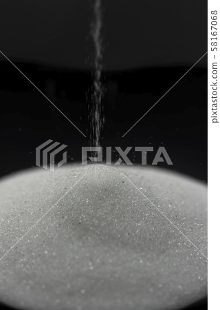 Hourglass black background close-up 58167068