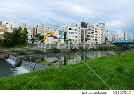 Yodo River and building town at dusk Yodo River and building town at dusk 58167907