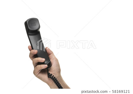 Hand holding handset Hand holding handset 58169121