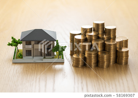House model and stacked money 58169307