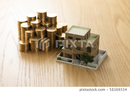 Stacked money house model hand 58169334