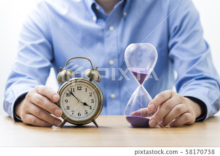 Businessman hourglass 58170738